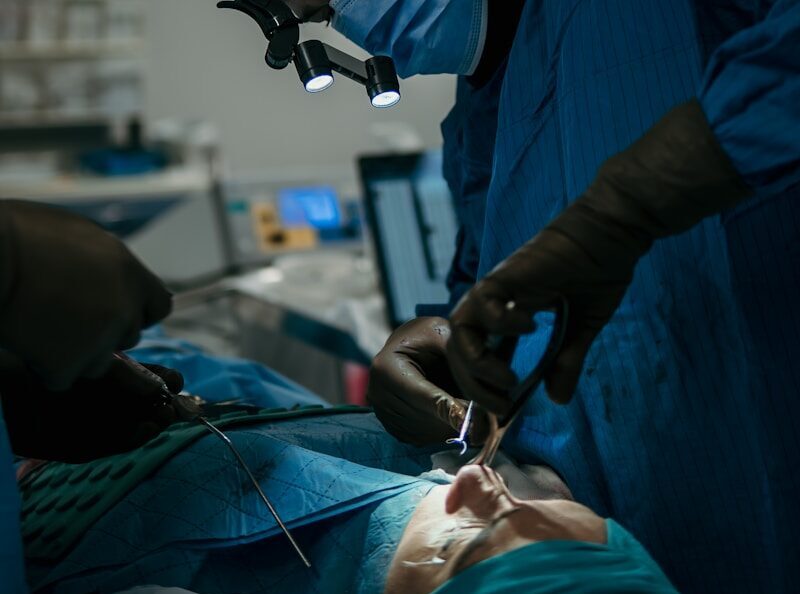 a person in a hospital operating on a patient